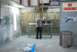 Brad preparing a strainer for painting