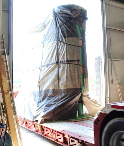 large dual basket strainer going through warehouse garage door