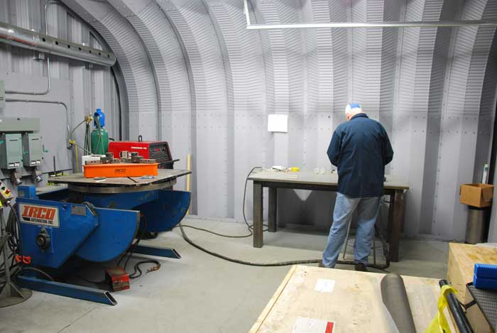preparing to weld in Sure Flow's clean welding room