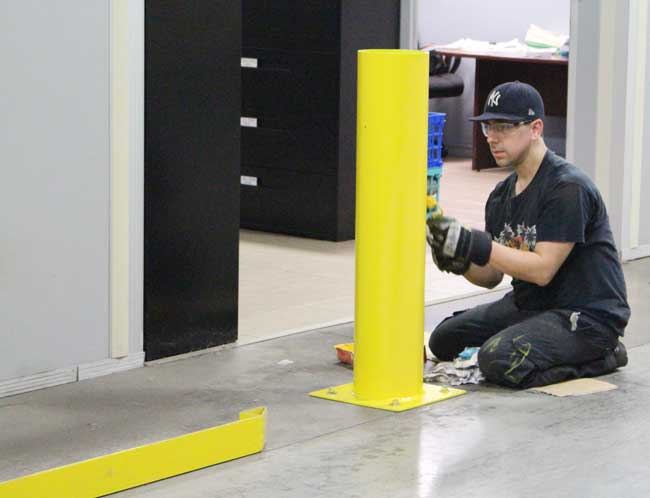 painting safety barriers at Sure Flow