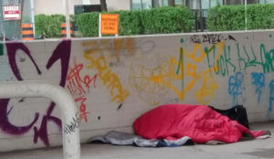 homeless person in sleeping bag
