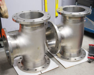 two titanium Tee strainers under construction