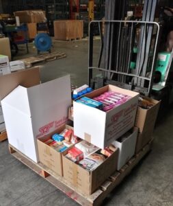 pallet on forklift with Sure Flow Equipment food donation to Salvation Army 2022