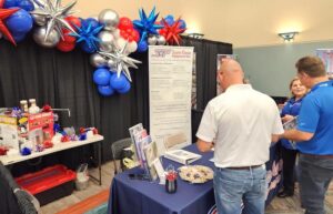 Visitors at the Sure Flow booth at the Texas City Trade Show